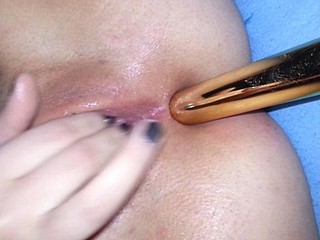 My girl getting an anal stimulation with a dildo
